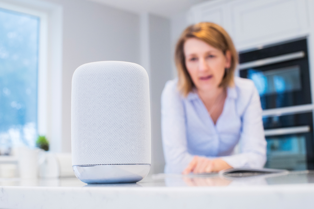 woman using voice search at home
