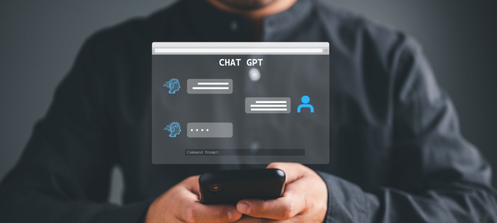 Business Owner Using ChatGPT on Phone